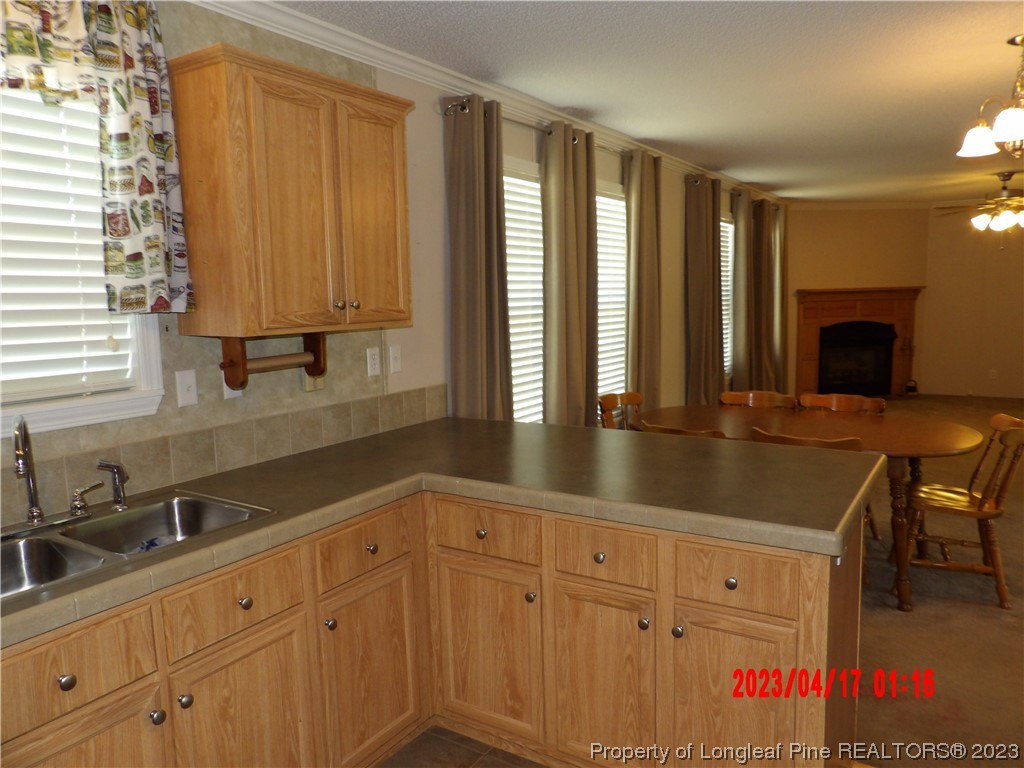 7349 Roslin Farm Road Hope Mills, NC 28348 - Photo 5 of 23 a bathroom with a sink and a mirror