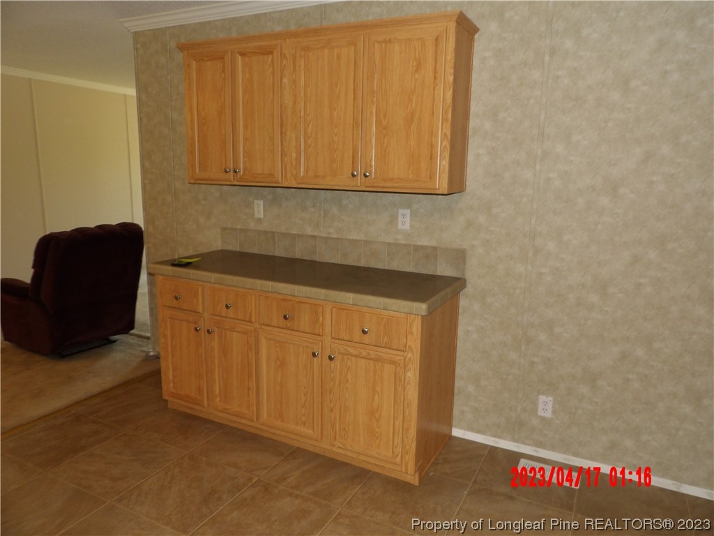 7349 Roslin Farm Road Hope Mills, NC 28348 - Photo 6 of 23 a view of cabinets and wooden floor