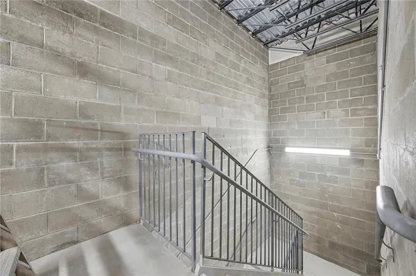 a view of a room with wooden floors and led lights