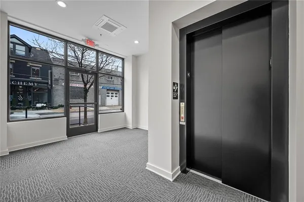a view of an empty room and window