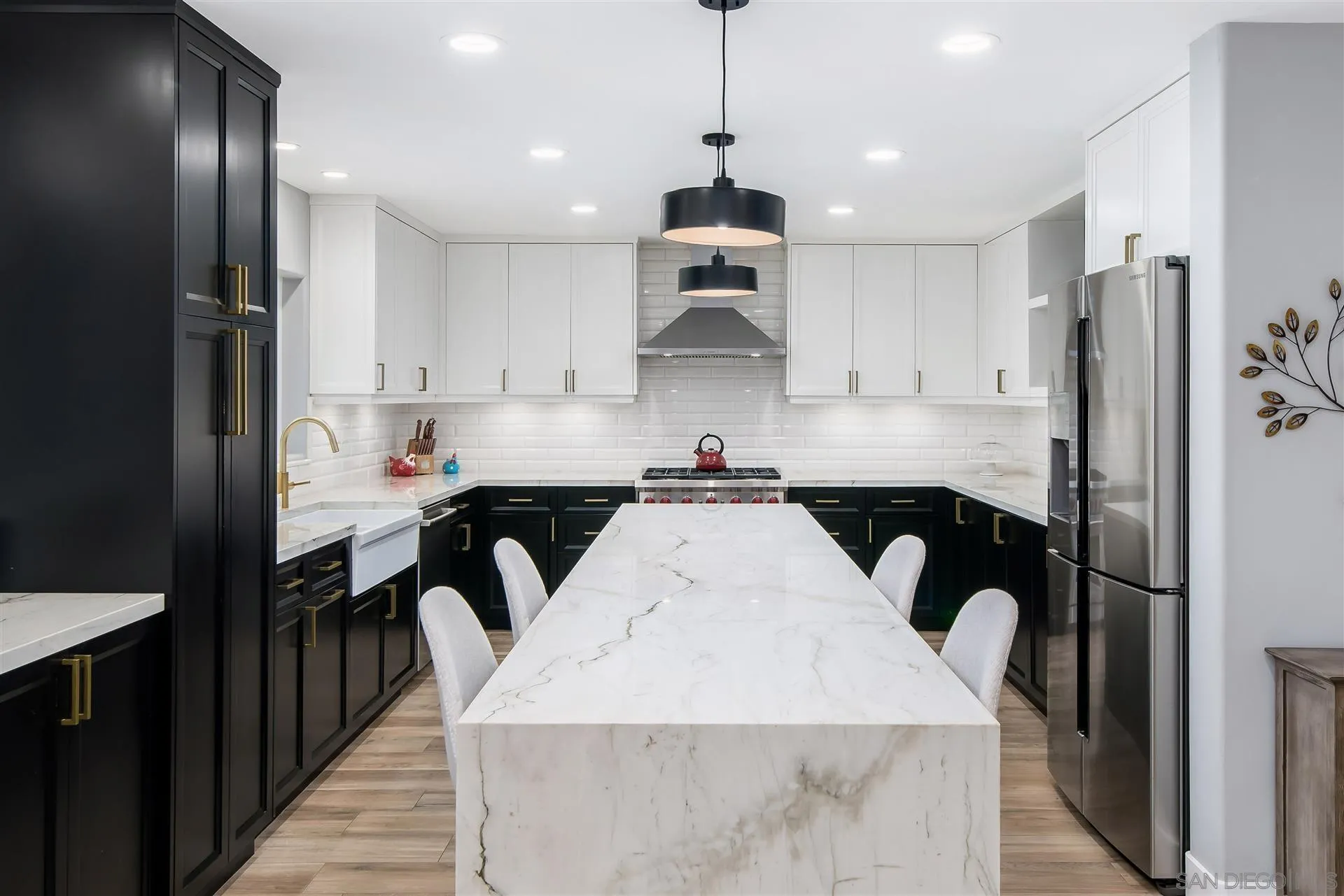 815 Marisa Lane Encinitas, CA 92024 - Photo 11 of 41 a kitchen with kitchen island granite countertop a sink stainless steel appliances and cabinets