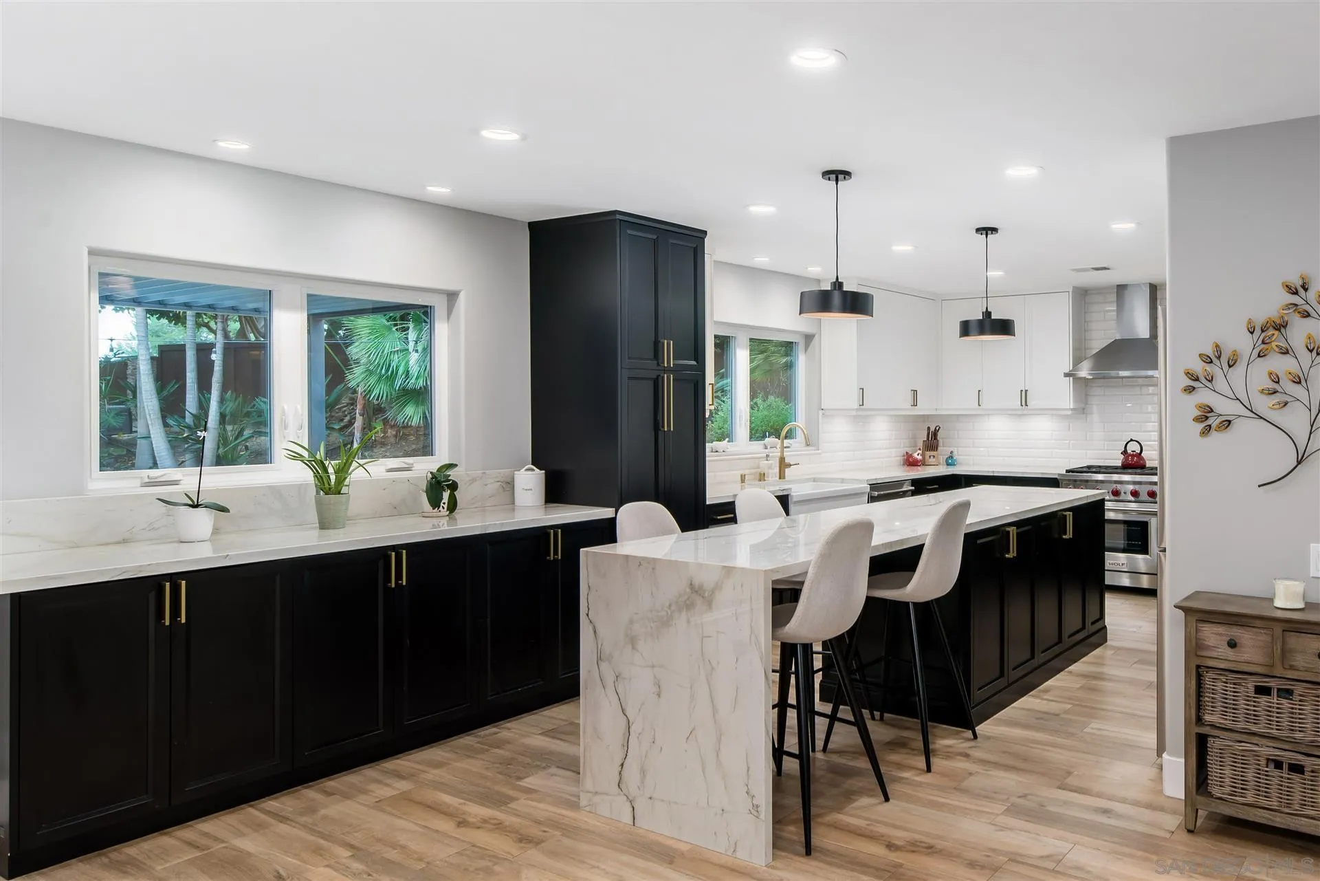 815 Marisa Lane Encinitas, CA 92024 - Photo 14 of 41 a kitchen with kitchen island granite countertop a sink stove and refrigerator
