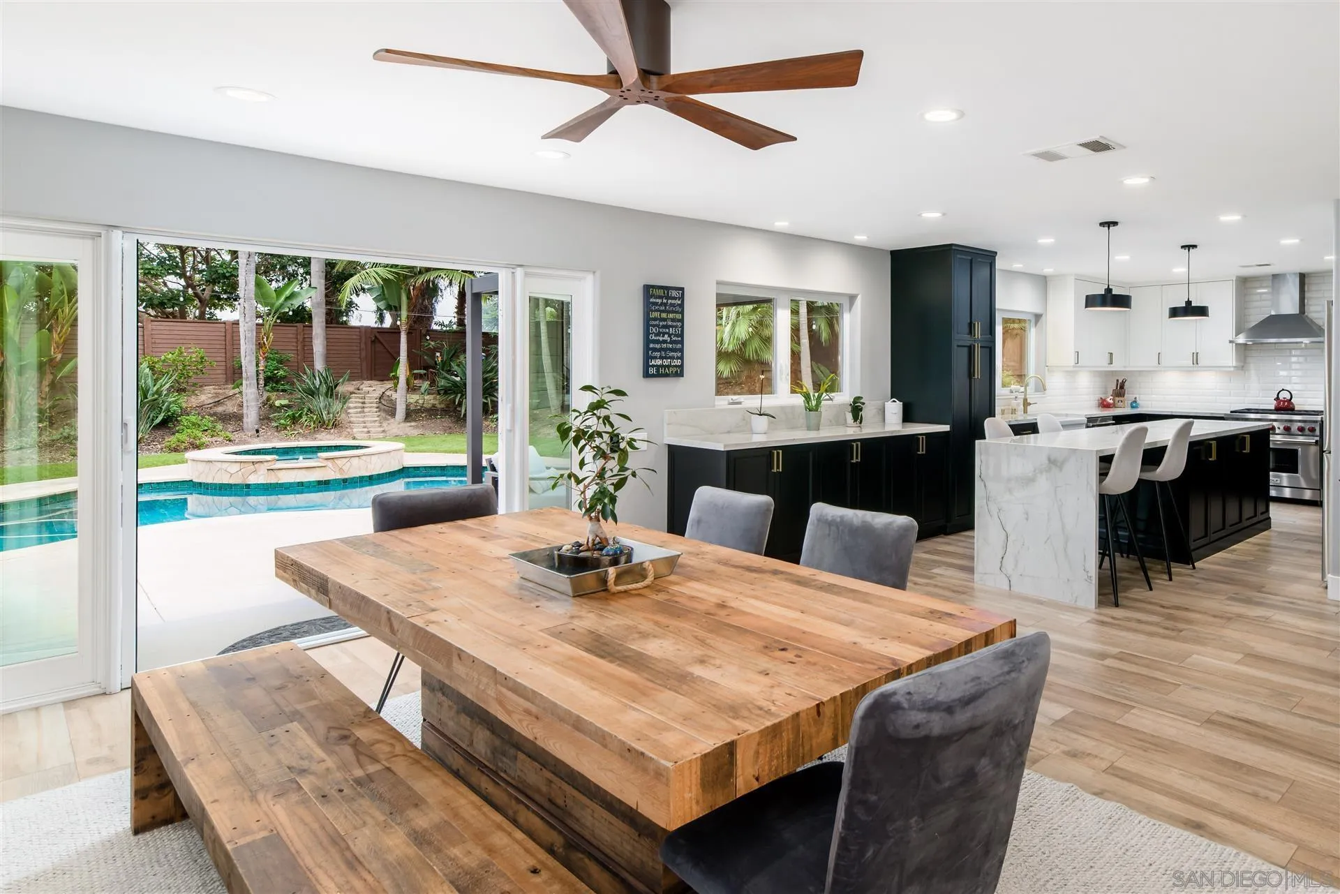 815 Marisa Lane Encinitas, CA 92024 - Photo 16 of 41 a dining room with wooden floor and window