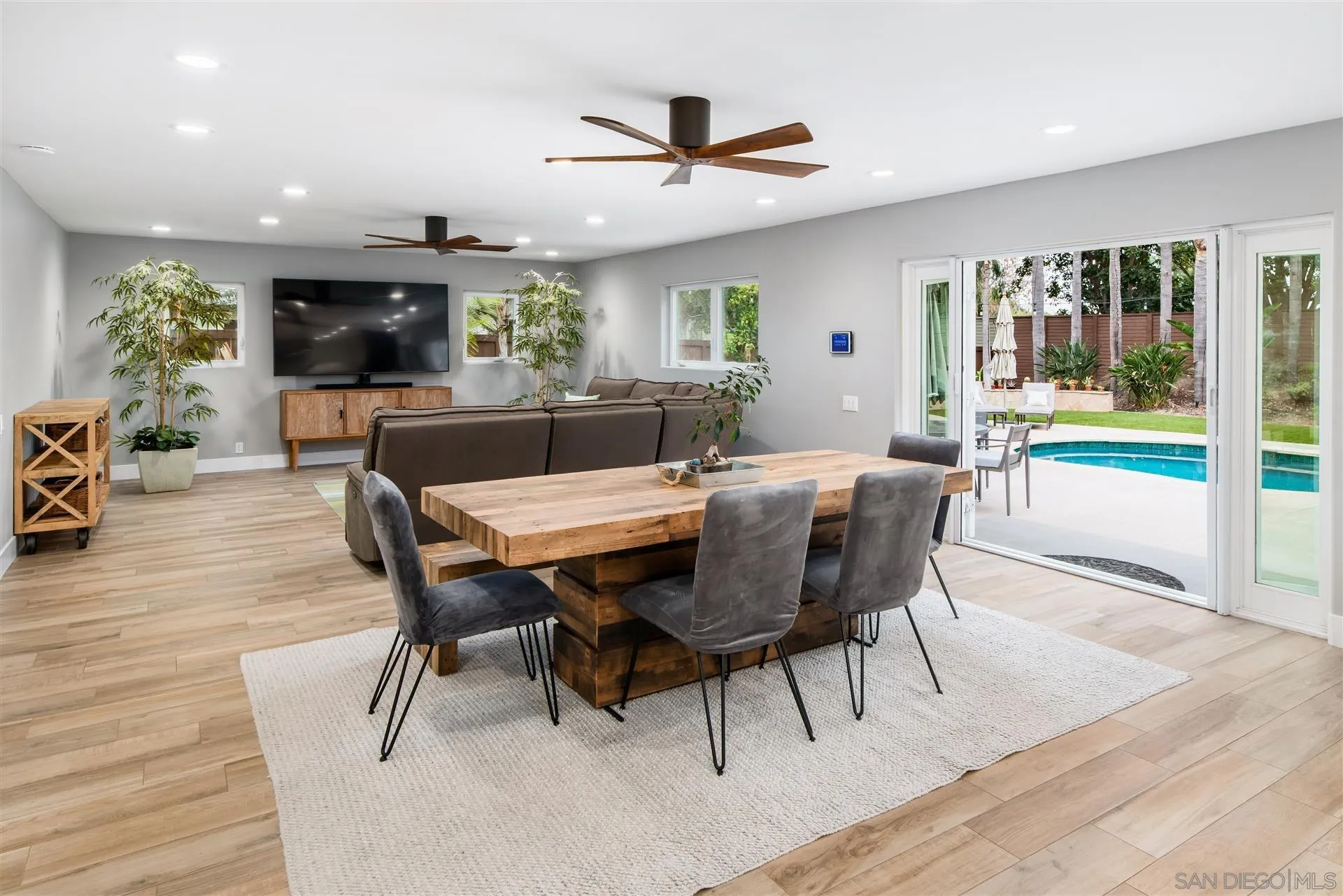815 Marisa Lane Encinitas, CA 92024 - Photo 17 of 41 a view of a dining room with furniture window and wooden floor
