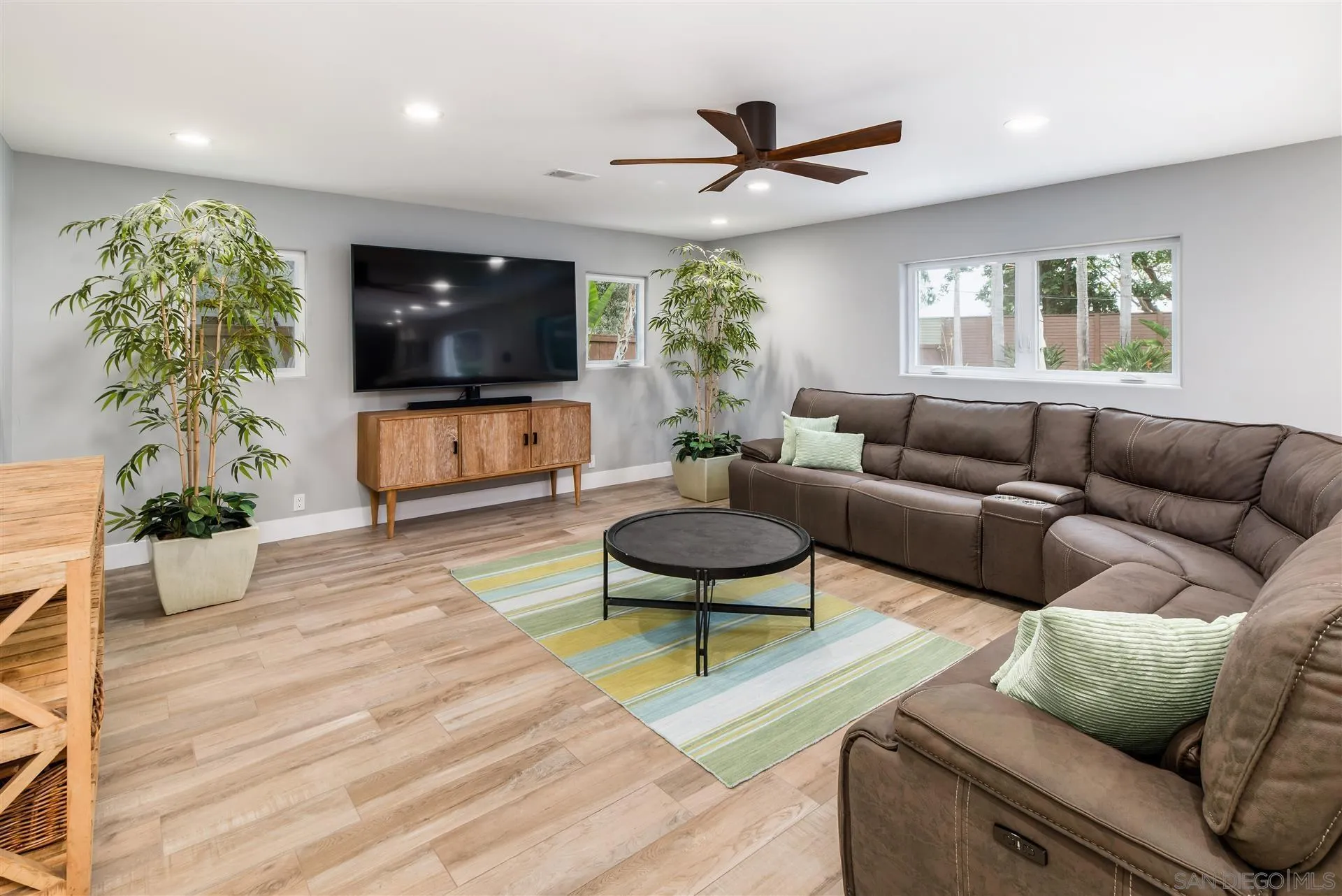 815 Marisa Lane Encinitas, CA 92024 - Photo 18 of 41 a living room with furniture and a flat screen tv