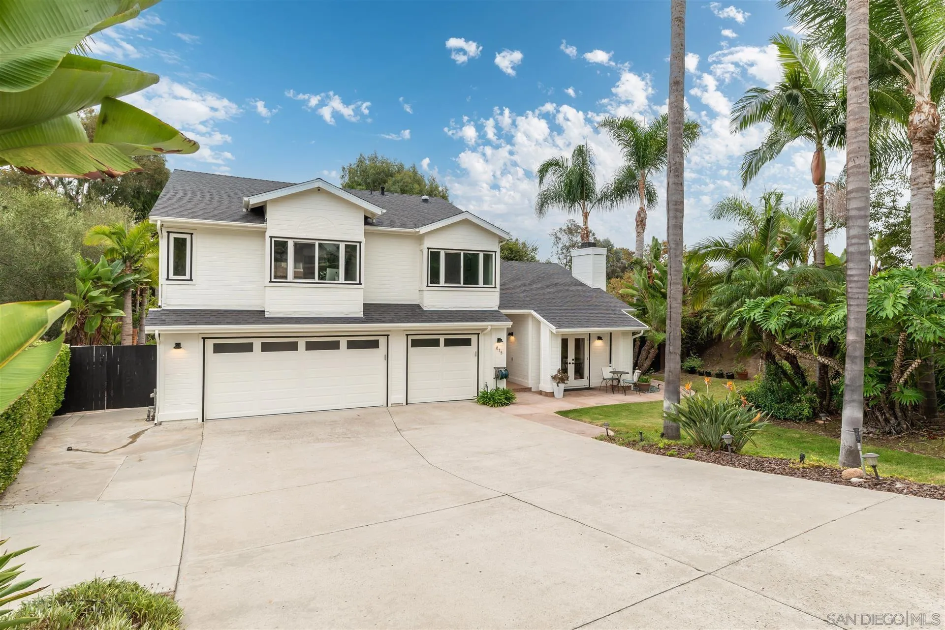 815 Marisa Lane Encinitas, CA 92024 - Photo 2 of 41 a front view of a house with a yard and garage