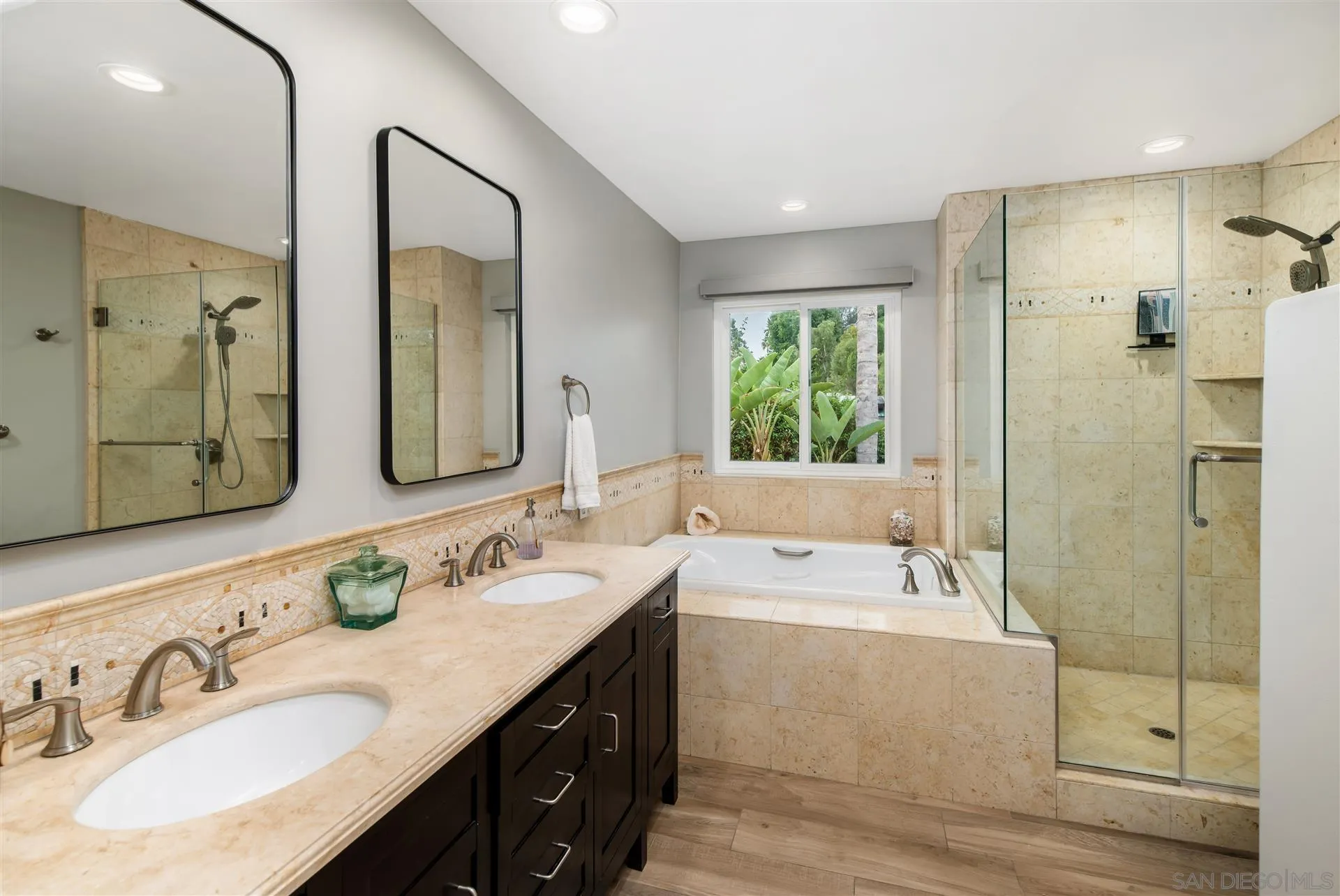 815 Marisa Lane Encinitas, CA 92024 - Photo 23 of 41 a bathroom with a double vanity sink large mirror and shower