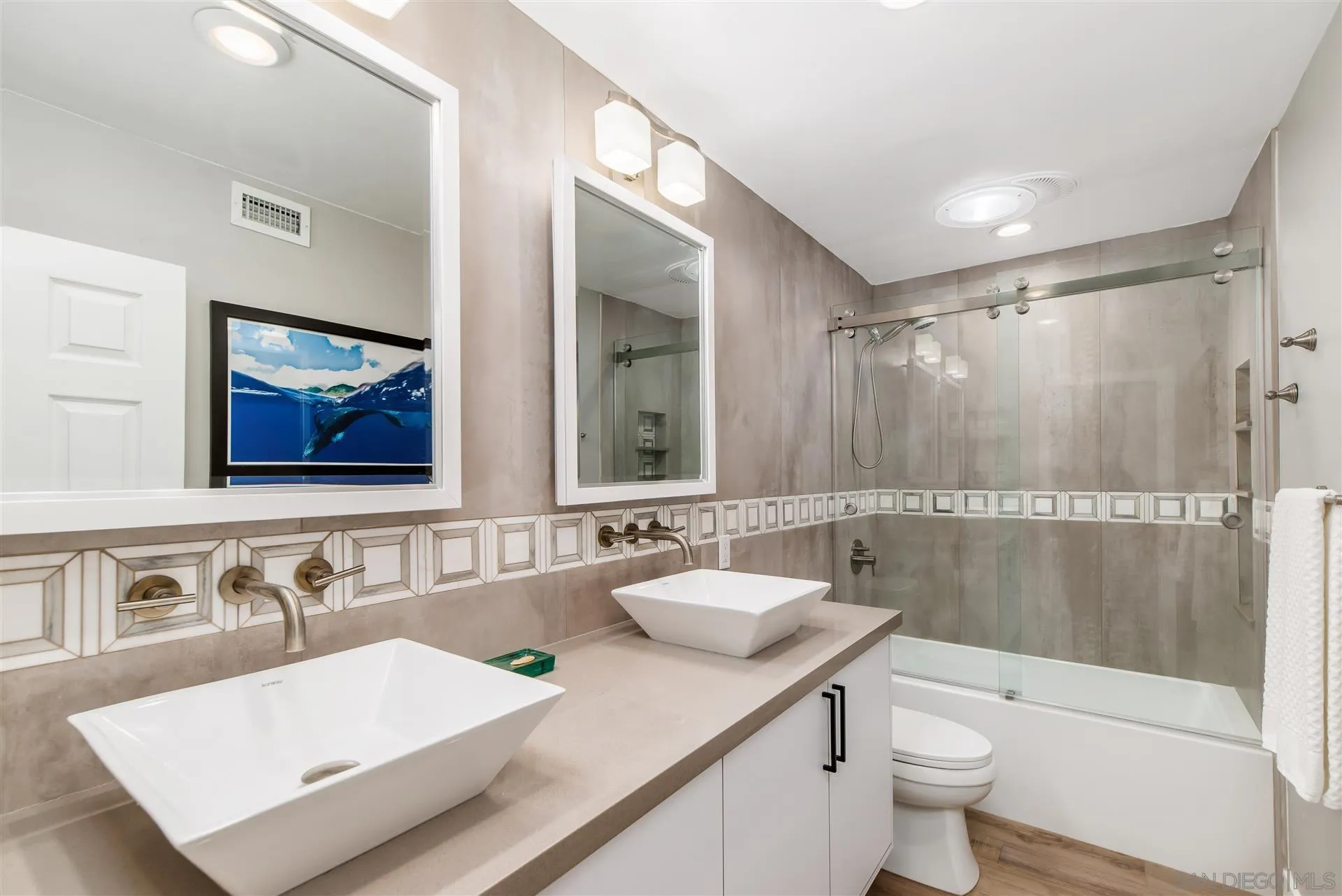 815 Marisa Lane Encinitas, CA 92024 - Photo 26 of 41 a bathroom with a sink and a mirror