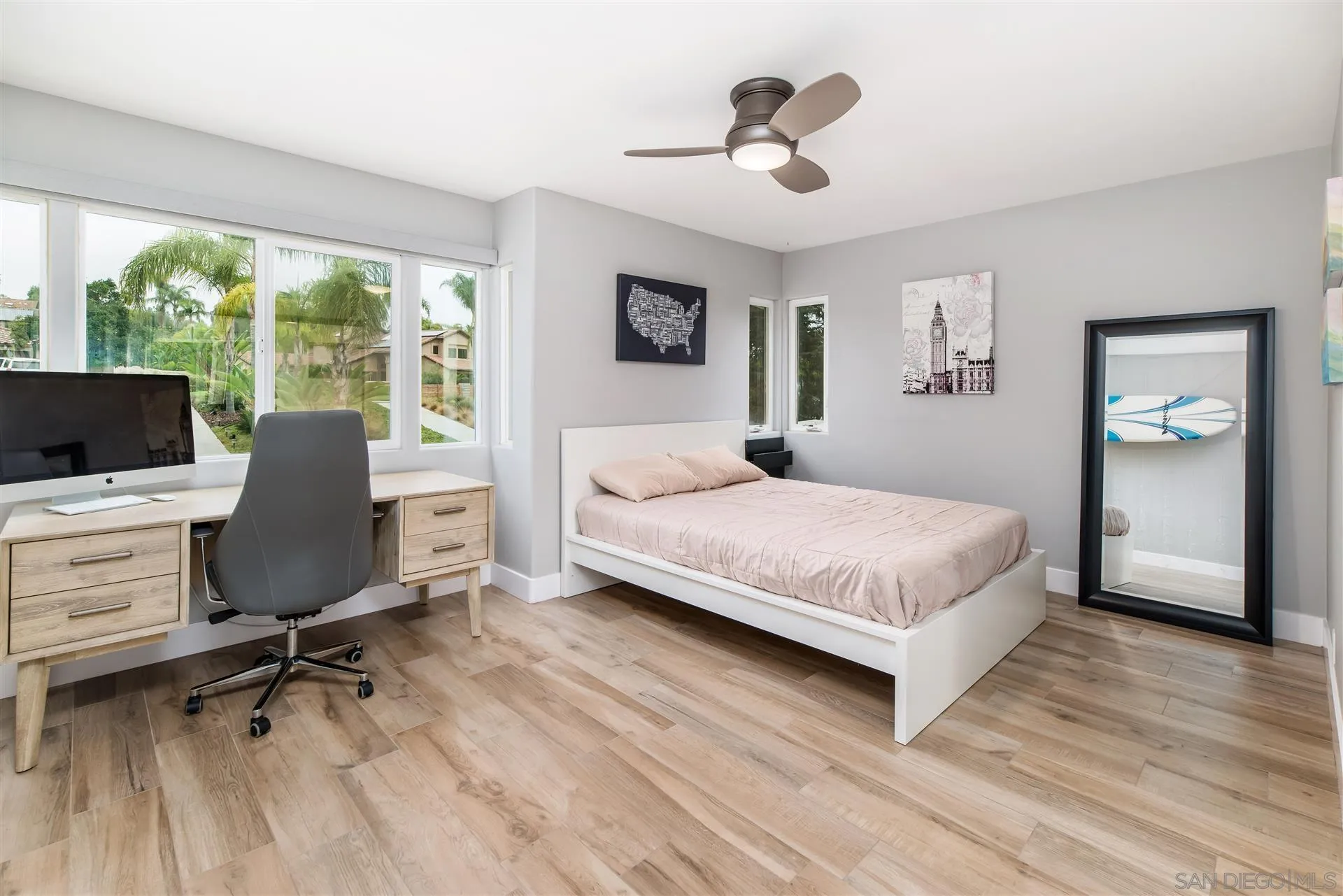 815 Marisa Lane Encinitas, CA 92024 - Photo 27 of 41 a bedroom with a bed and a desk