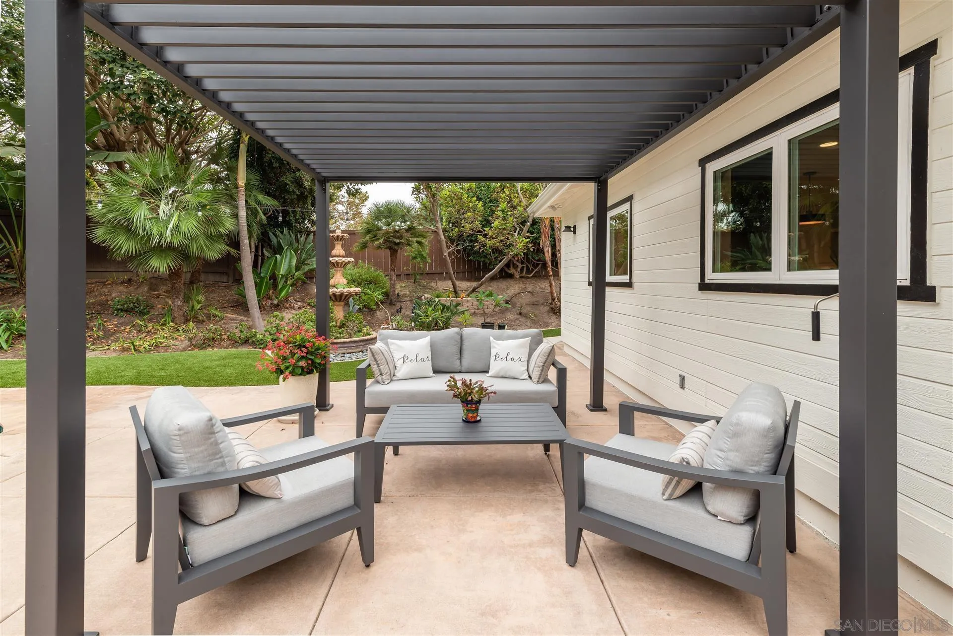 815 Marisa Lane Encinitas, CA 92024 - Photo 32 of 41 a outdoor space with patio the couches and a dining table with garden view