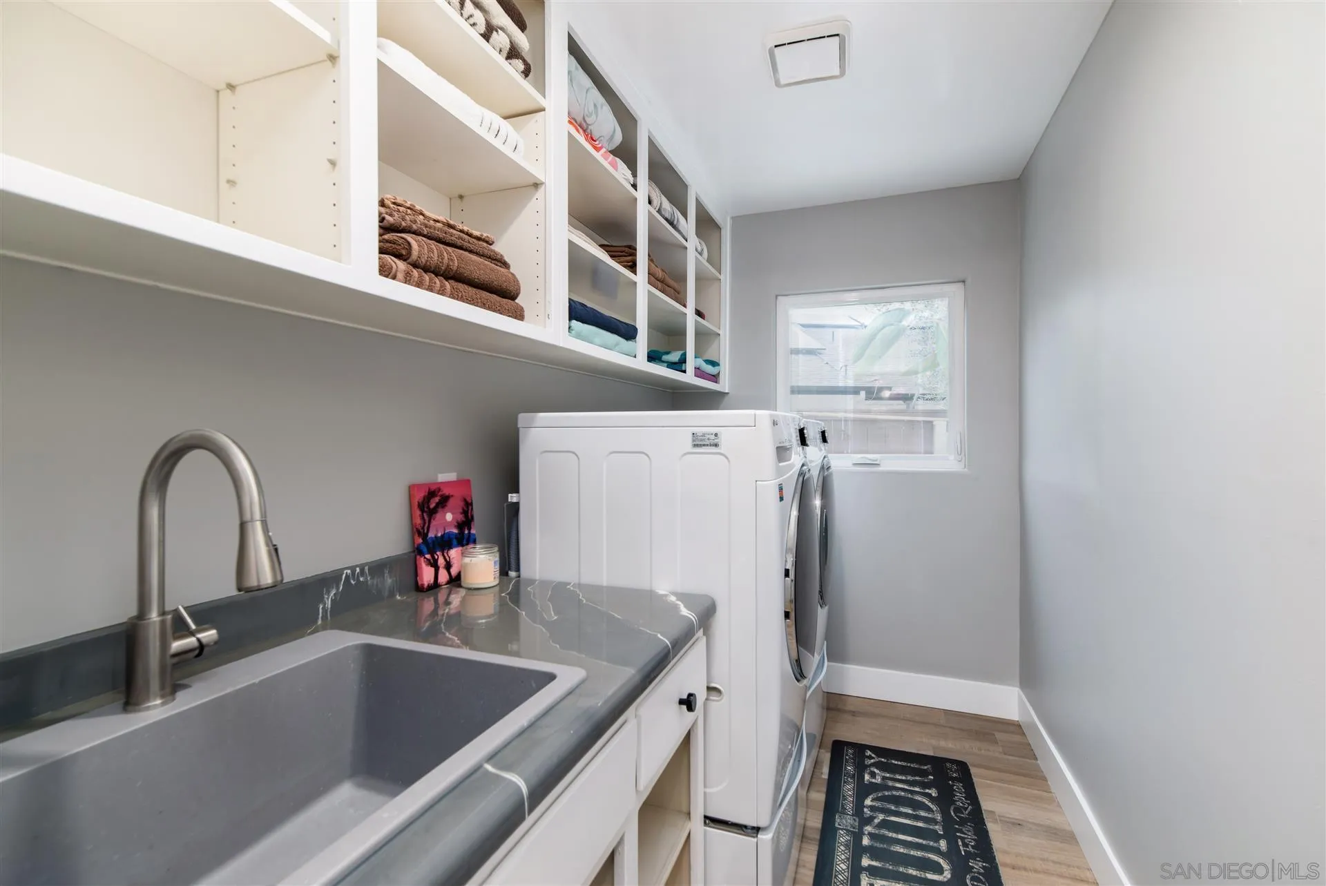 815 Marisa Lane Encinitas, CA 92024 - Photo 39 of 41 a kitchen with a sink and a refrigerator