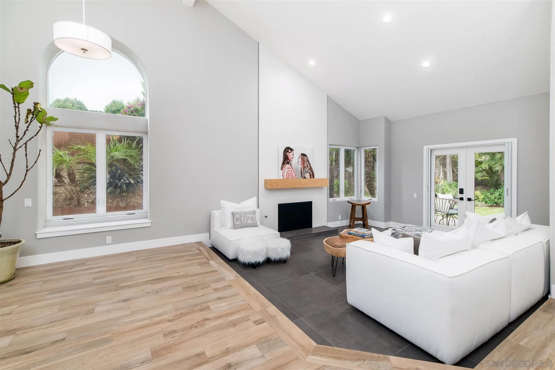 815 Marisa Lane Encinitas, CA 92024 - Photo 4 of 41 a living room with fireplace furniture and a large window