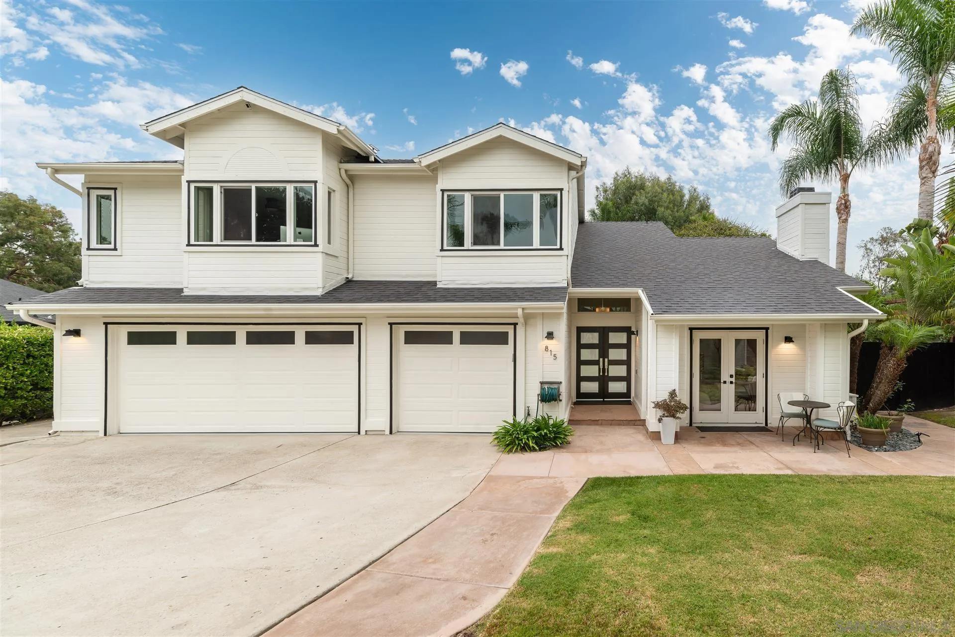 815 Marisa Lane Encinitas, CA 92024 - Photo 41 of 41 a front view of a house with a yard and garage