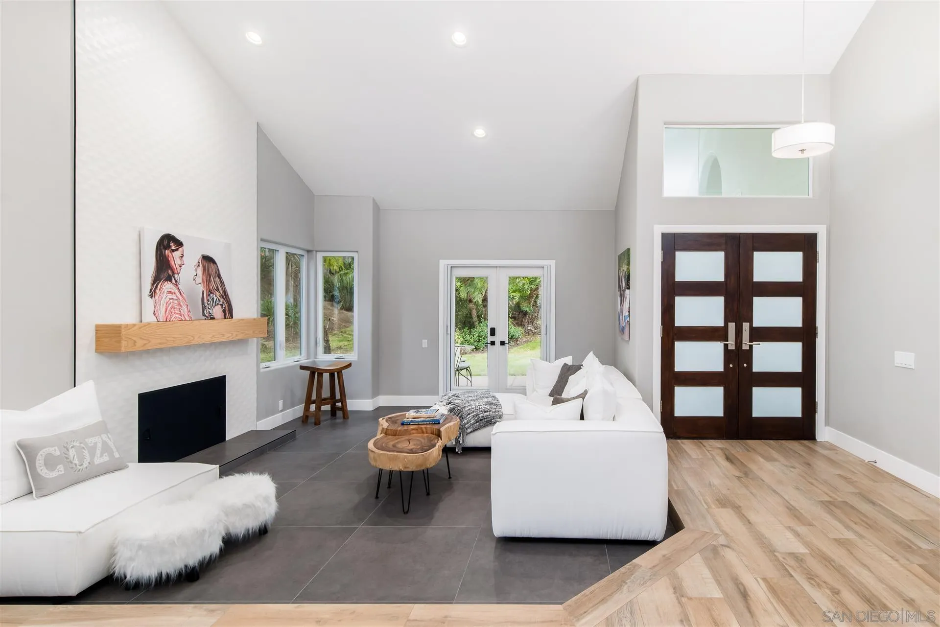 815 Marisa Lane Encinitas, CA 92024 - Photo 6 of 41 a living room with furniture and a fireplace