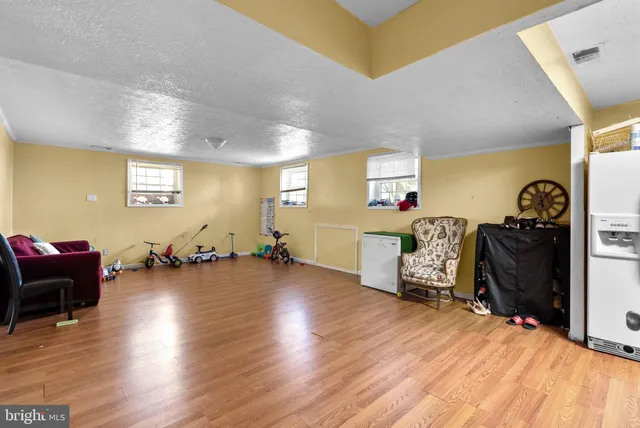 a room with furniture and a wooden floor