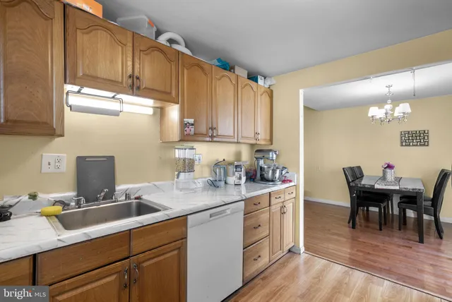 a kitchen with a sink cabinets and window