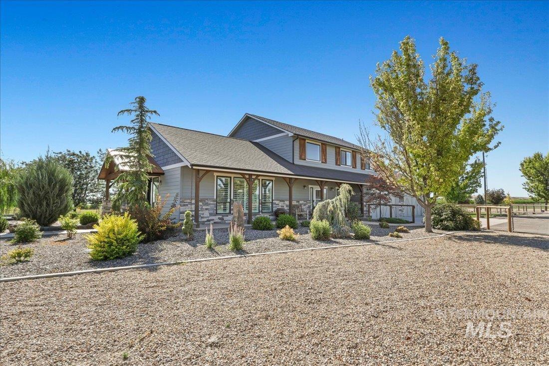 26019 Klahr Road Parma, ID 83660 - Photo 1 of 1 View of front of house featuring covered porch and roof with shingles