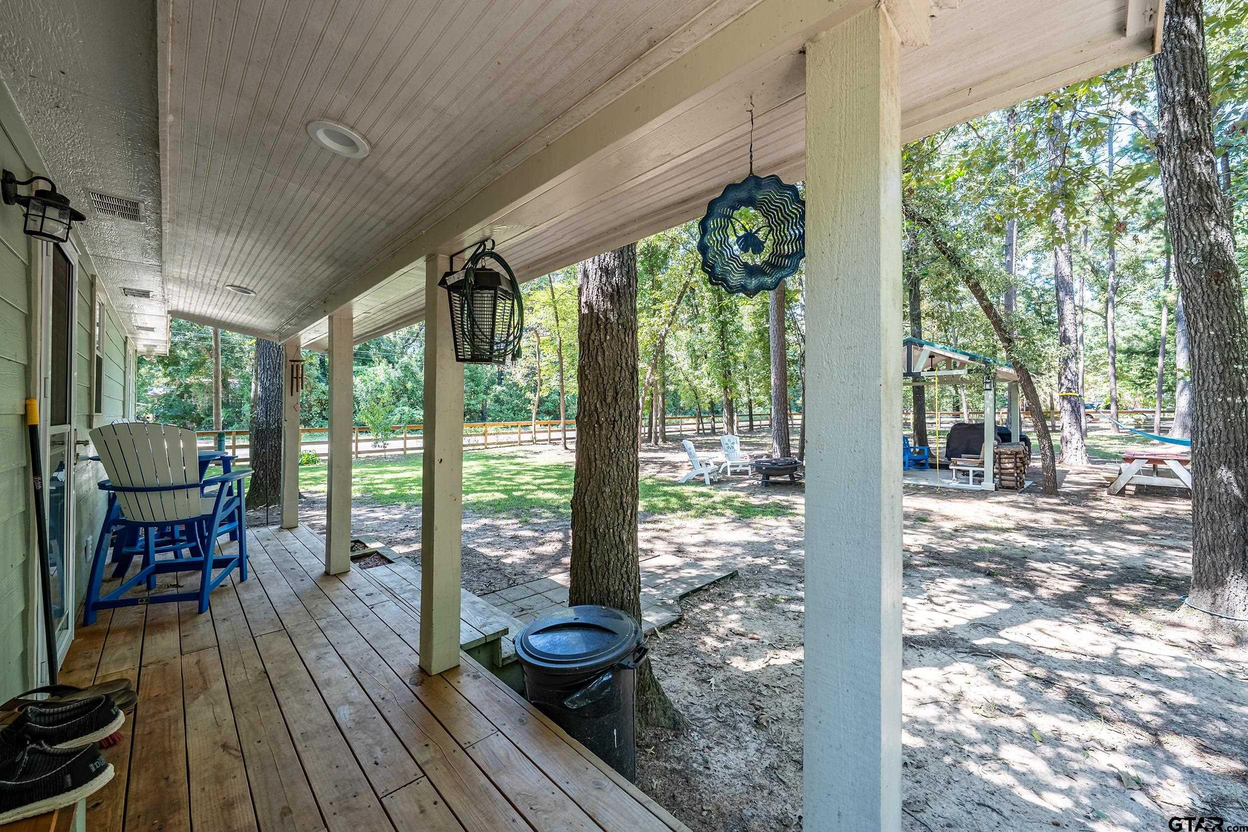 230 Deborah Street Bullard, TX 75757 - Photo 14 of 23 a view of a living room and floor to ceiling window with wooden floor