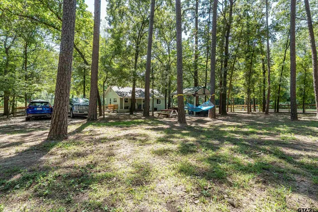 a view of outdoor space with deck and tree