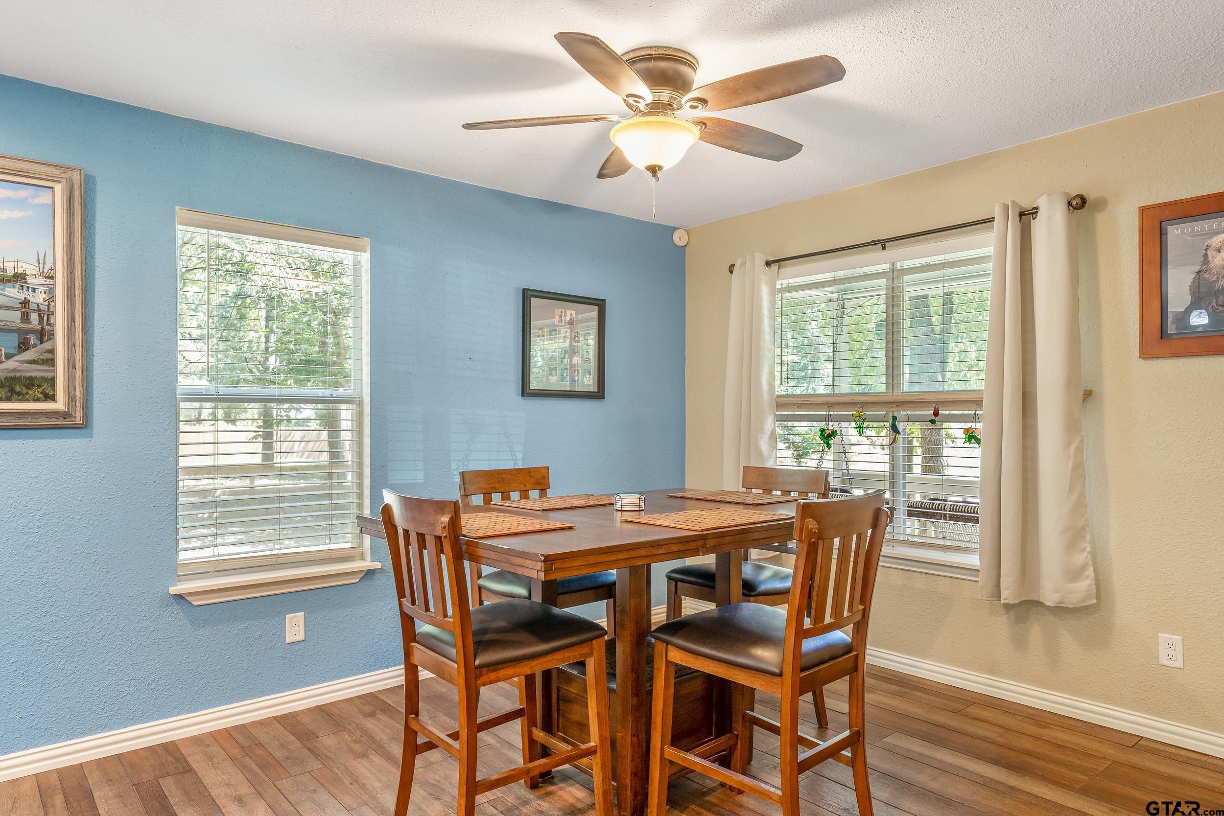 230 Deborah Street Bullard, TX 75757 - Photo 5 of 23 a dining room with furniture a chandelier and wooden floor