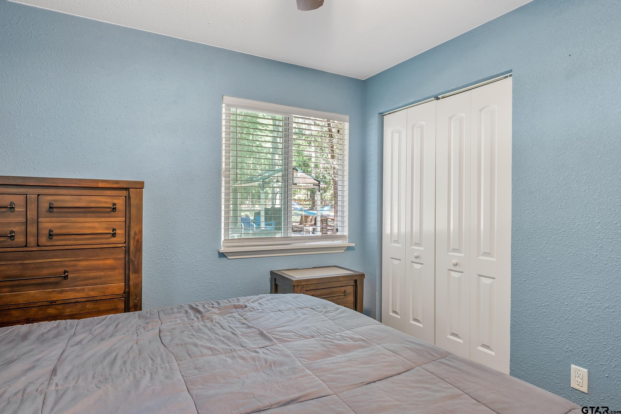 230 Deborah Street Bullard, TX 75757 - Photo 10 of 23 a bedroom with a bed and a window