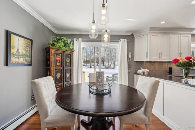 a kitchen with stainless steel appliances granite countertop a stove refrigerator sink and cabinets