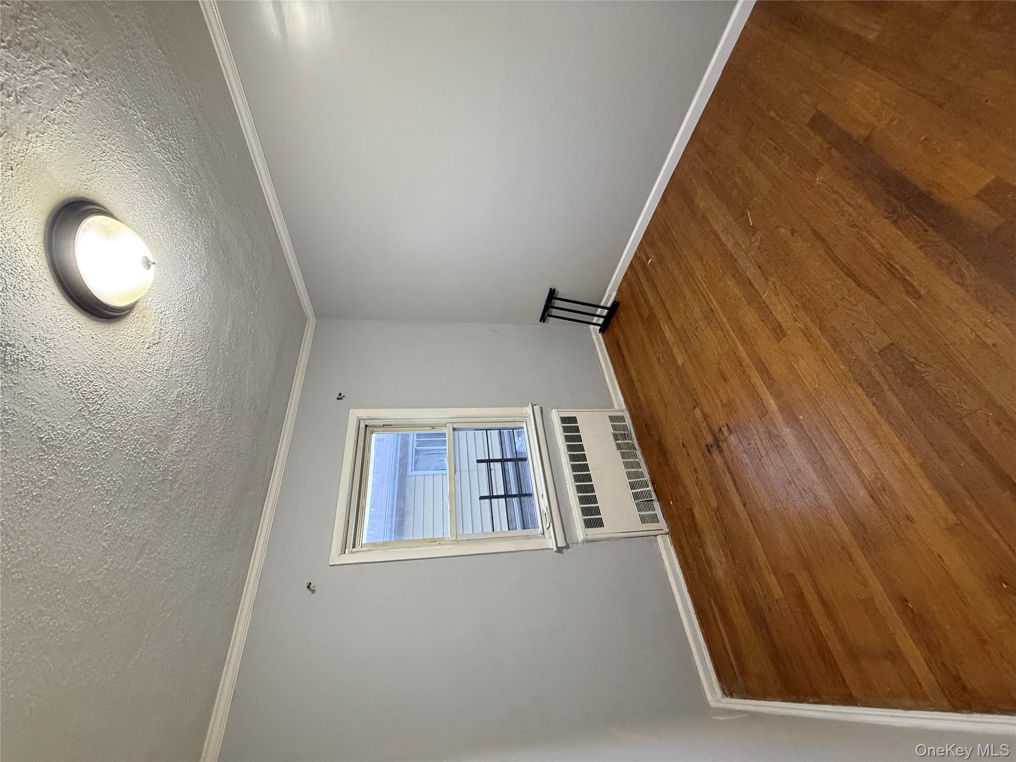 109-11 225th Street, Unit 2 Queens, NY 11429 - Photo 9 of 13 an empty room with a window