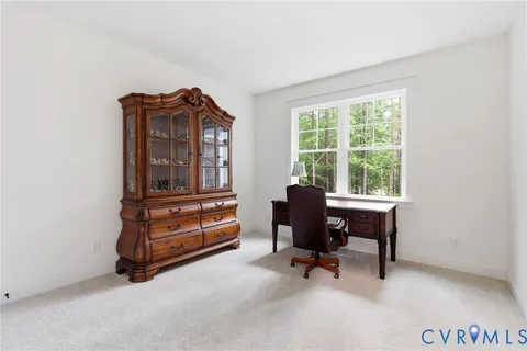 a kitchen with a sink a stove a refrigerator and white cabinets