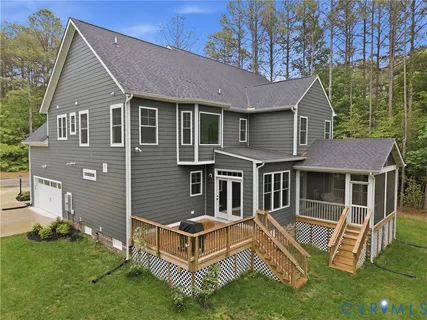 an aerial view of a house with a garden