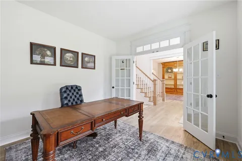 a view of workspace with furniture and a window