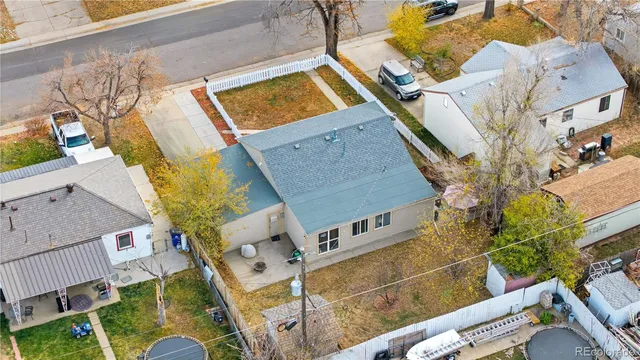 an aerial view of a house with a swimming pool
