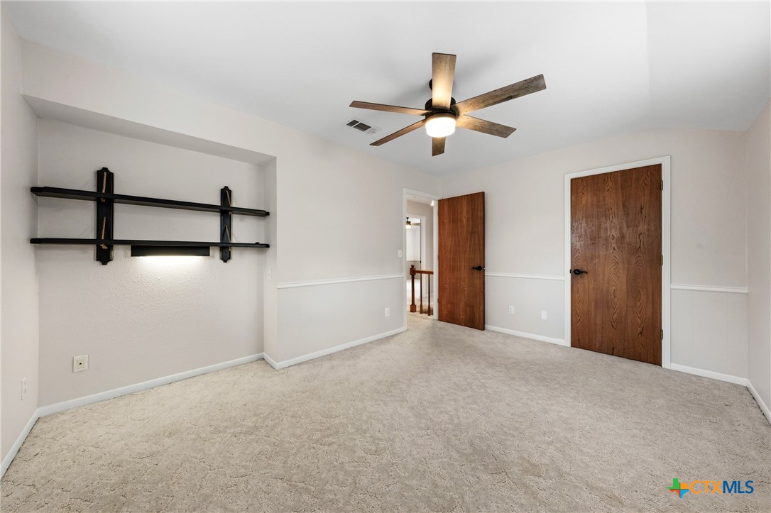 1903 North Harding Avenue Cameron, TX 76520 - Photo 34 of 44 a view of a livingroom with a ceiling fan and window