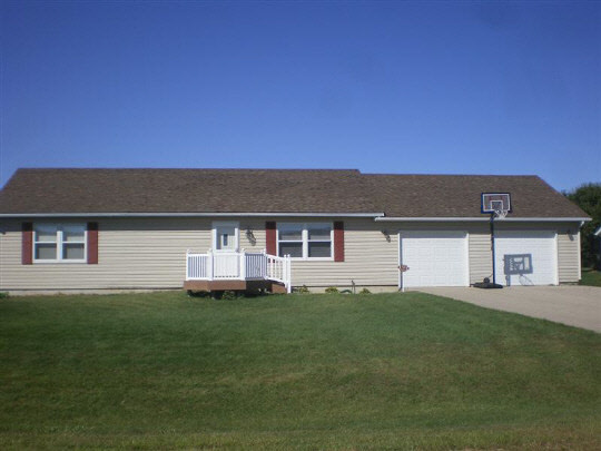 6780 Friday Road Byron, IL 61010 - Photo 1 of 6 front view of a house with a yard