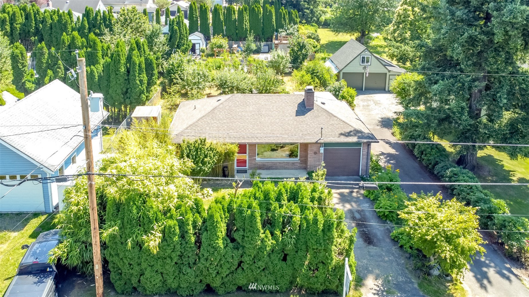 a aerial view of a house with a yard and plants