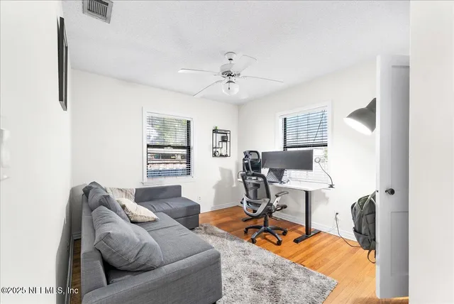 a living room with furniture and a window