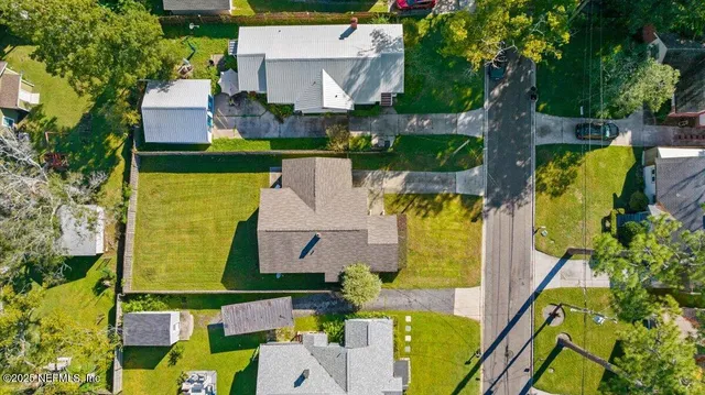 an aerial view of house with a swimming pool