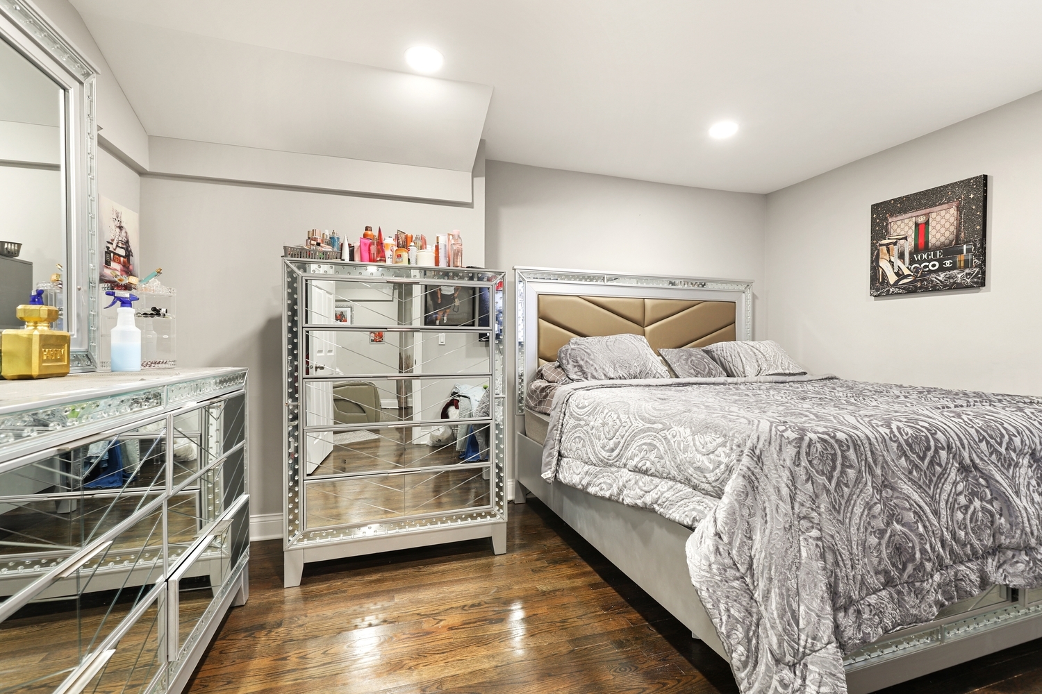 18433 Ridgewood Avenue Lansing, IL 60438 - Photo 13 of 26 a bedroom with a bed and a flat tv screen on the dresser