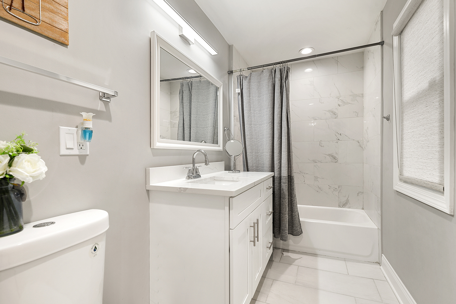 18433 Ridgewood Avenue Lansing, IL 60438 - Photo 15 of 26 a bathroom with a sink toilet and shower