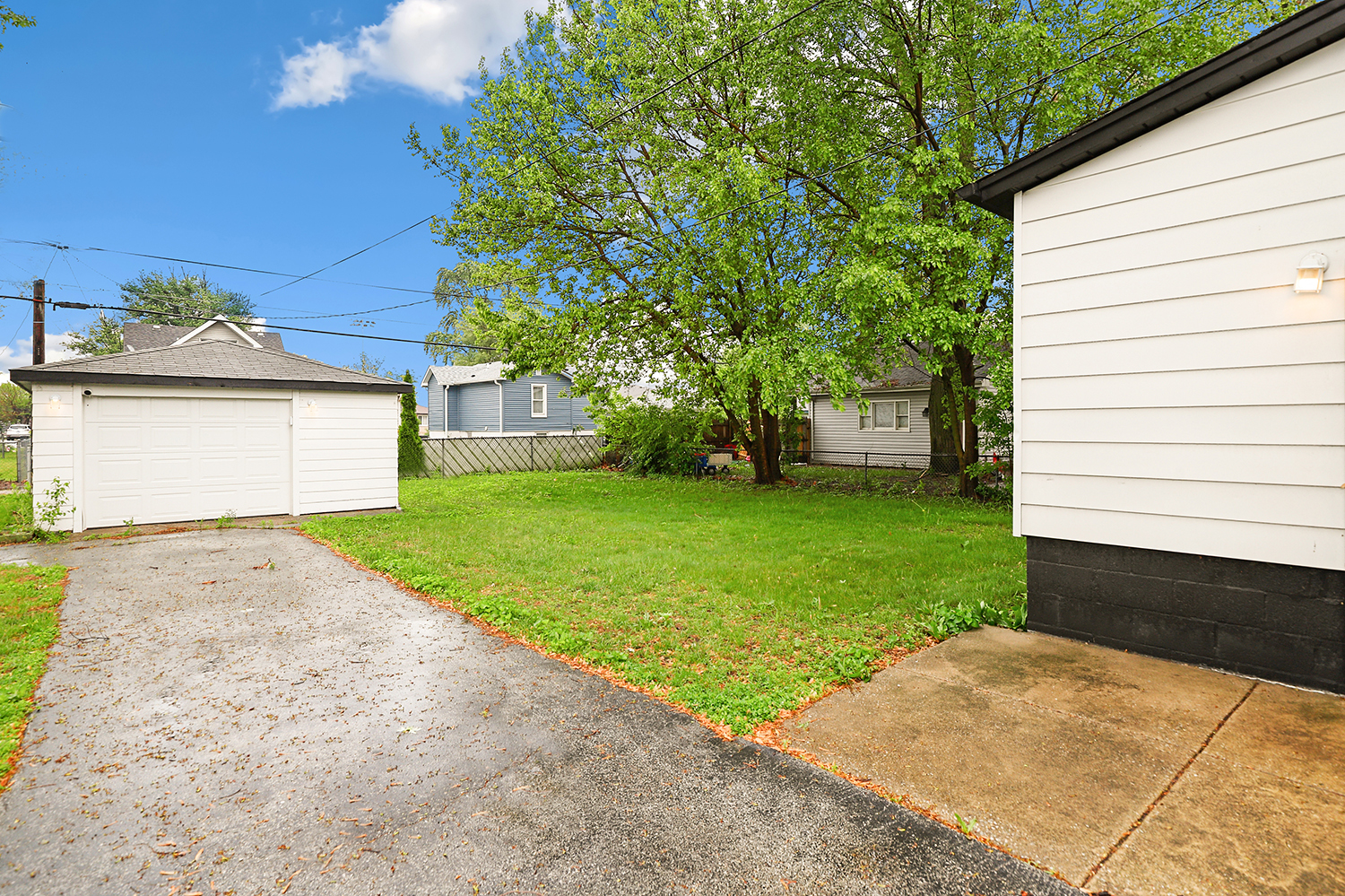 18433 Ridgewood Avenue Lansing, IL 60438 - Photo 23 of 26 a view of a backyard with a garden