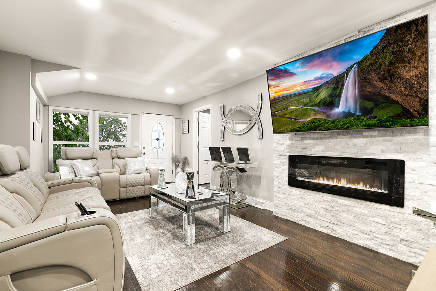 18433 Ridgewood Avenue Lansing, IL 60438 - Photo 3 of 26 a living room with furniture a flat screen tv and a fireplace