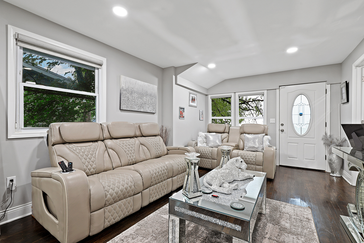 18433 Ridgewood Avenue Lansing, IL 60438 - Photo 4 of 26 a living room with furniture a flat screen tv and a window