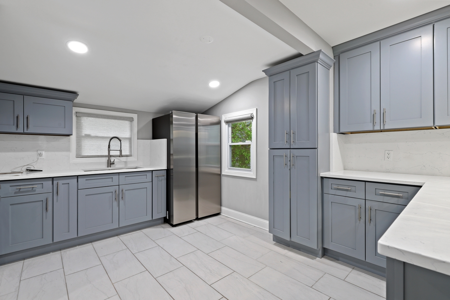 18433 Ridgewood Avenue Lansing, IL 60438 - Photo 6 of 26 a kitchen with a refrigerator sink and cabinets