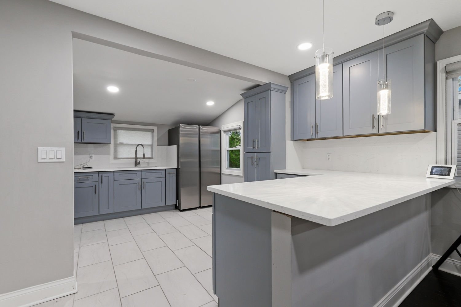 18433 Ridgewood Avenue Lansing, IL 60438 - Photo 7 of 26 a kitchen with a sink a counter top space cabinets and stainless steel appliances
