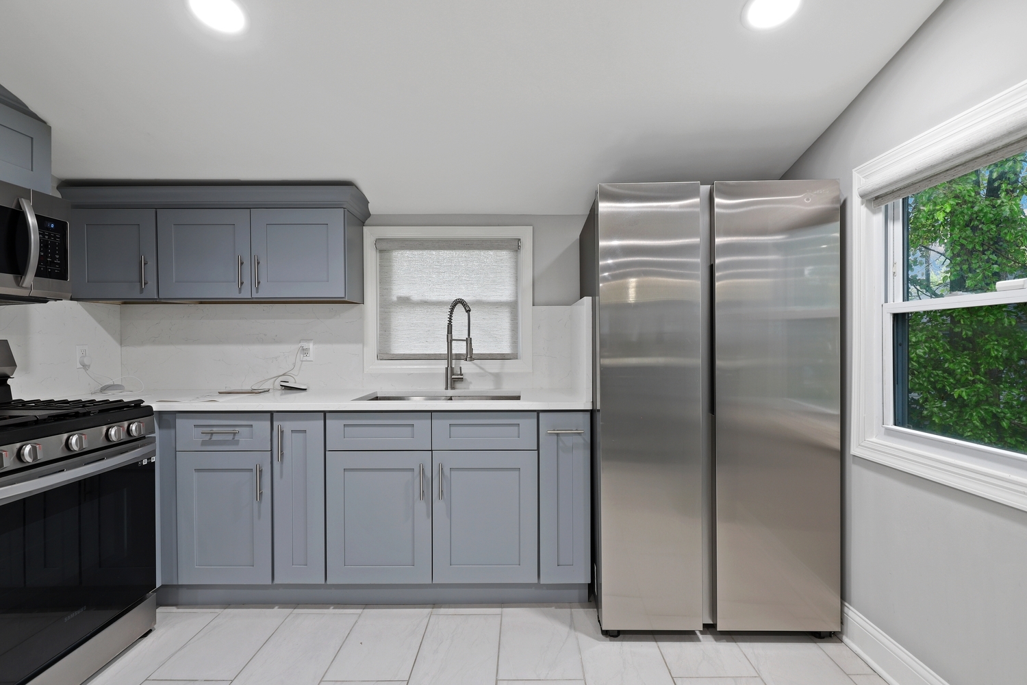 18433 Ridgewood Avenue Lansing, IL 60438 - Photo 8 of 26 a kitchen with stainless steel appliances granite countertop a refrigerator and a sink