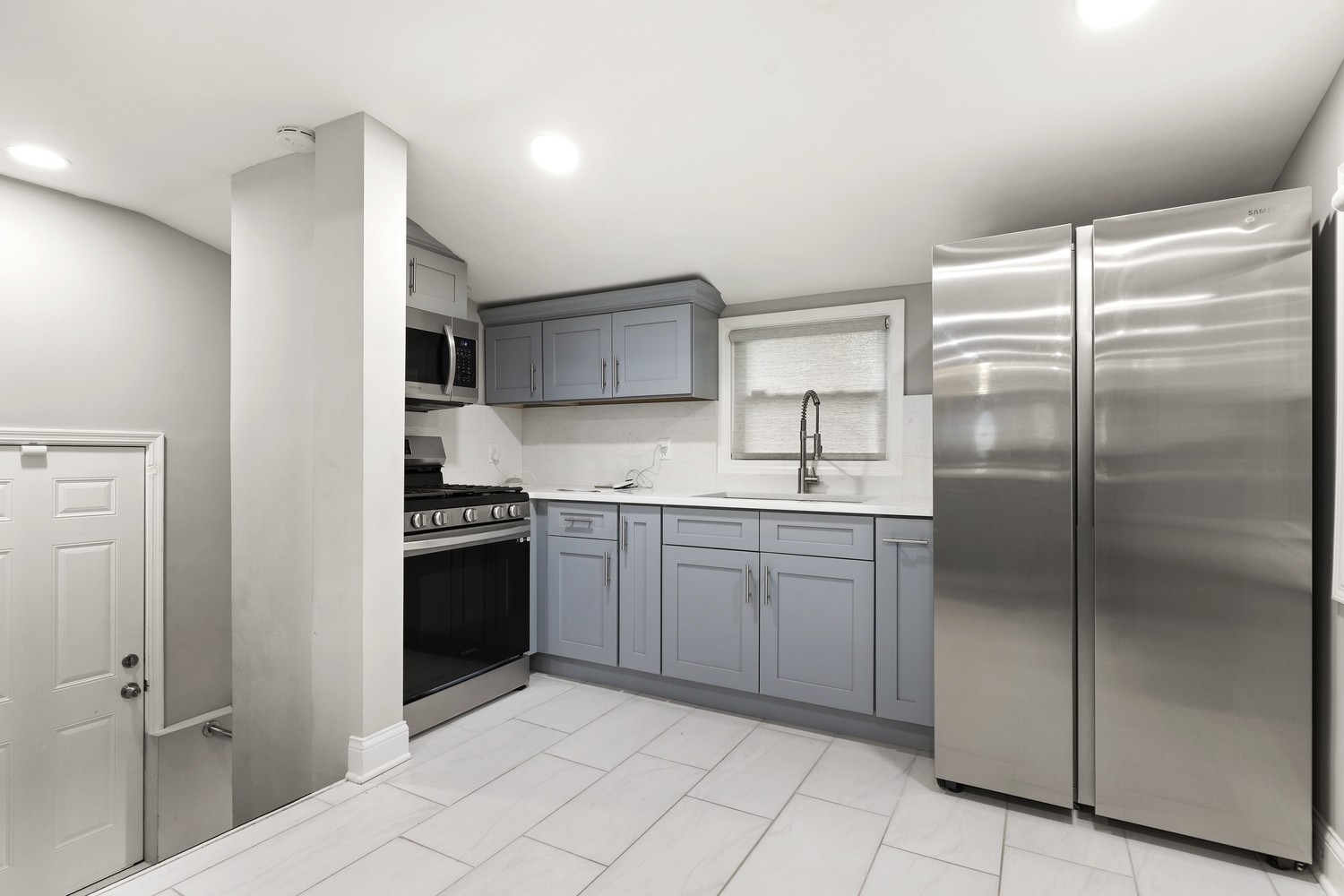 18433 Ridgewood Avenue Lansing, IL 60438 - Photo 9 of 26 a kitchen with a refrigerator and a sink