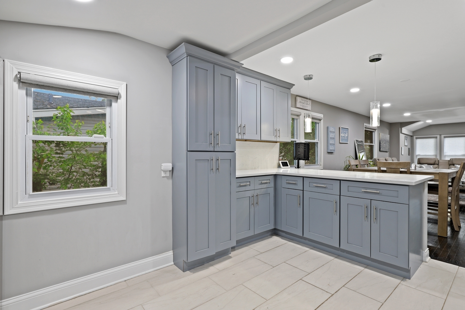 18433 Ridgewood Avenue Lansing, IL 60438 - Photo 10 of 26 a kitchen with white cabinets and white appliances