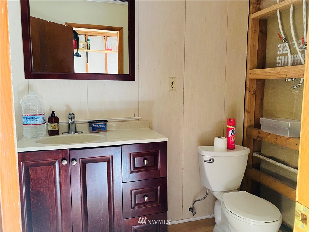 4558 Decatur Drive Ferndale, WA 98248 - Photo 9 of 20 a bathroom with a toilet a sink and a window