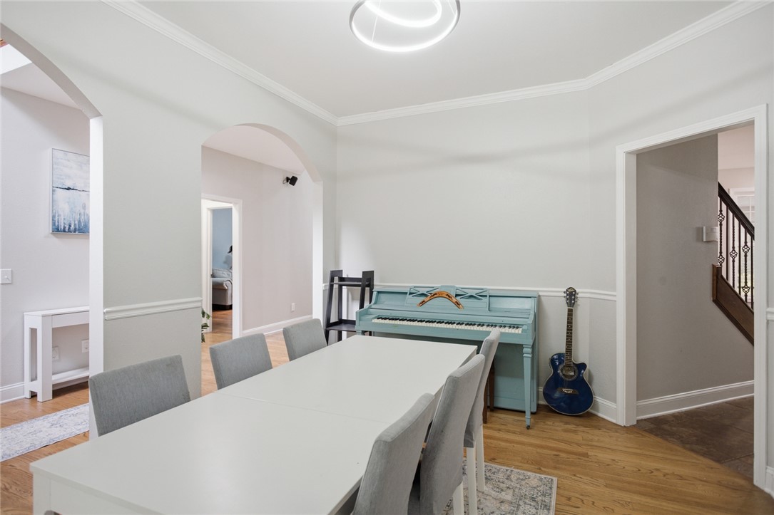 207 Devonhurst Drive Seneca, SC 29678 - Photo 10 of 50 This space features crown molding, hardwood floors, and a bright, open feel.