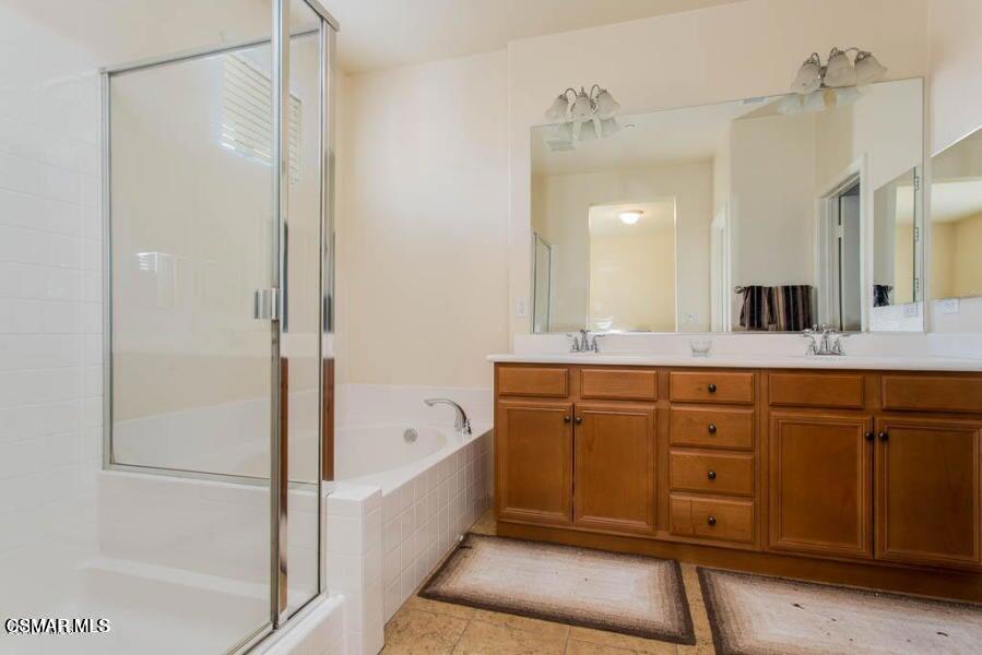 1654 Heywood Street, Unit D Simi Valley, CA 93065 - Photo 12 of 14 a spacious bathroom with a tub sink and mirror