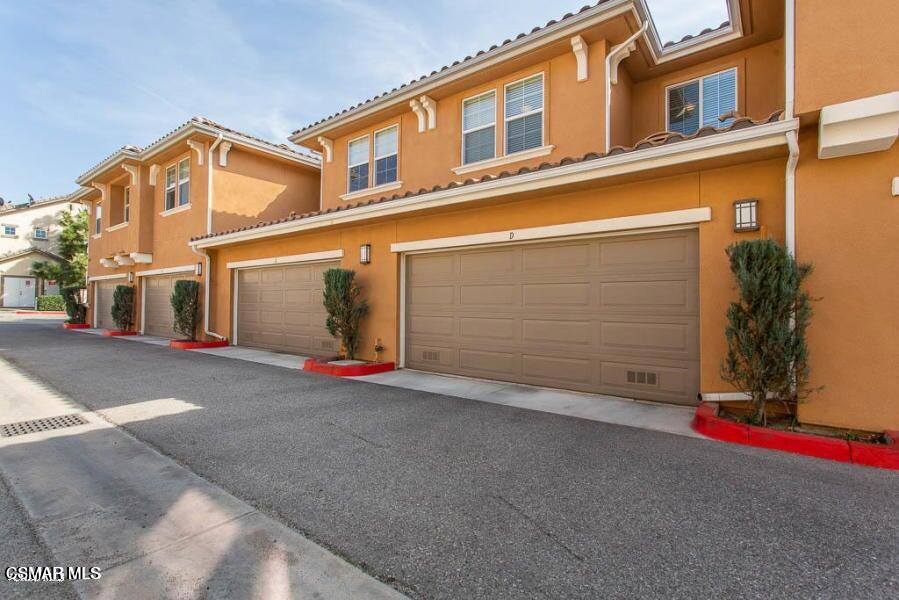 1654 Heywood Street, Unit D Simi Valley, CA 93065 - Photo 13 of 14 a view of a street with garage